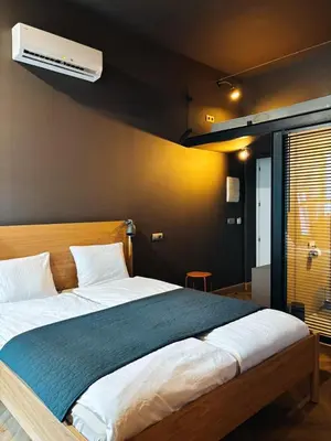 Łóżko lub łóżka w pokoju w obiekcie Apartment Loft Center Warsaw lok 1