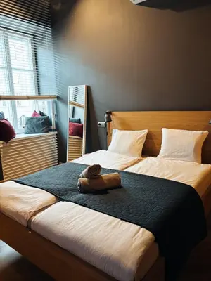 Łóżko lub łóżka w pokoju w obiekcie Apartment Loft Center Warsaw lok 1
