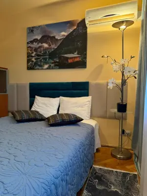 Łóżko lub łóżka w pokoju w obiekcie Scenic Centrum Apartments