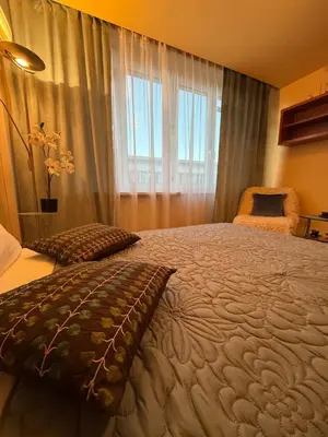 Łóżko lub łóżka w pokoju w obiekcie Scenic Centrum Apartments