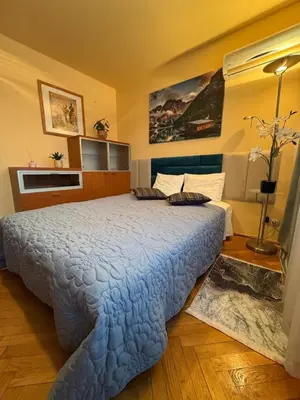 Łóżko lub łóżka w pokoju w obiekcie Scenic Centrum Apartments
