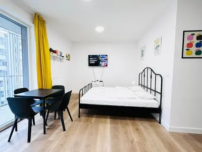 Łóżko lub łóżka w pokoju w obiekcie Ordona Charming Studio IV