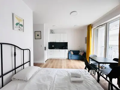 Łóżko lub łóżka w pokoju w obiekcie Ordona Charming Studio IV