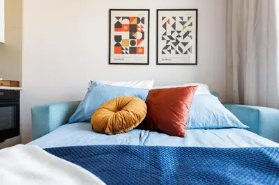 Łóżko lub łóżka w pokoju w obiekcie Kashmir Comfort Apartment