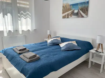 Łóżko lub łóżka w pokoju w obiekcie Łopuszańska 57 by Solarento