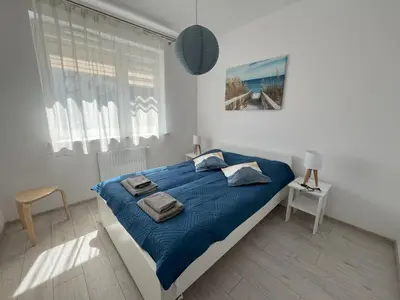Łóżko lub łóżka w pokoju w obiekcie Łopuszańska 57 by Solarento
