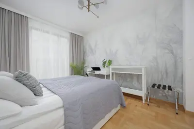 Łóżko lub łóżka w pokoju w obiekcie Teodorowicza Elegant Apartment with Parking in Warsaw by Noclegi Renters