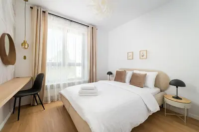 Łóżko lub łóżka w pokoju w obiekcie Racławicka 7 Superior Apartment by BookingHost