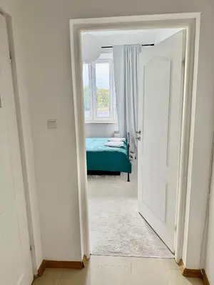 Łóżko lub łóżka w pokoju w obiekcie OhMyHome Stara Ochota