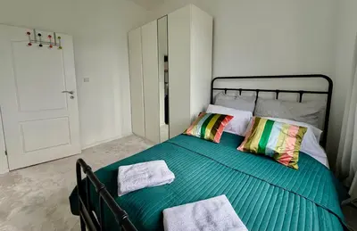 Łóżko lub łóżka w pokoju w obiekcie OhMyHome Stara Ochota