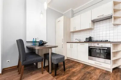 Kuchnia lub aneks kuchenny w obiekcie Apartament Chmielna by Your Freedom