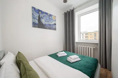 Łóżko lub łóżka w pokoju w obiekcie Marszałkowska City Centre Apartment by BookingHost