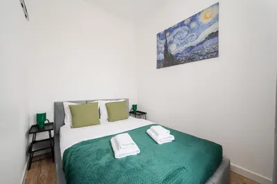 Łóżko lub łóżka w pokoju w obiekcie Marszałkowska City Centre Apartment by BookingHost