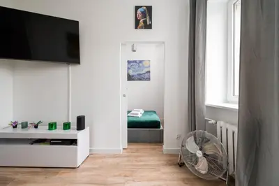 Telewizja i/lub zestaw kina domowego w obiekcie Marszałkowska City Centre Apartment by BookingHost