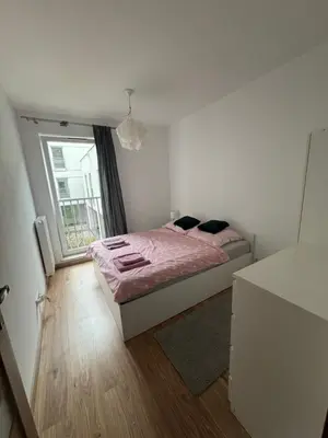 Łóżko lub łóżka w pokoju w obiekcie Komfortowy Dwupoziomowy Apartament