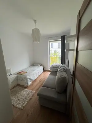 Łóżko lub łóżka w pokoju w obiekcie Komfortowy Dwupoziomowy Apartament