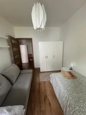 Łóżko lub łóżka w pokoju w obiekcie Komfortowy Dwupoziomowy Apartament