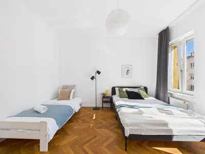 Łóżko lub łóżka w pokoju w obiekcie SuperApart Madalińskiego - Świetna lokalizacja