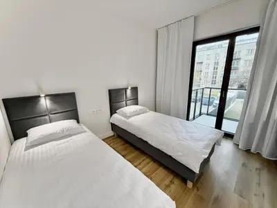 Łóżko lub łóżka w pokoju w obiekcie Comfort Studios Mokotów