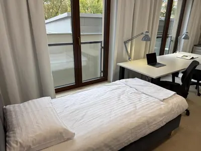 Łóżko lub łóżka w pokoju w obiekcie Comfort Studios Mokotów