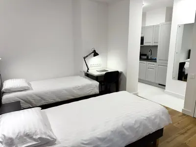 Łóżko lub łóżka w pokoju w obiekcie Comfort Studios Mokotów