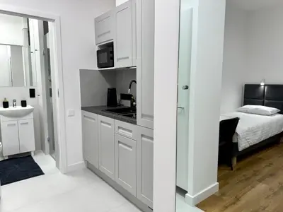 Łóżko lub łóżka w pokoju w obiekcie Comfort Studios Mokotów