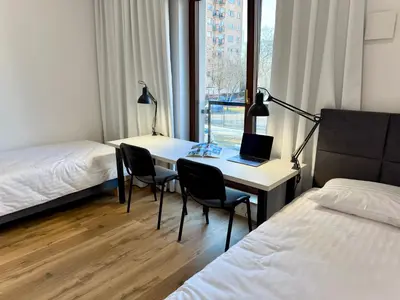 Łóżko lub łóżka w pokoju w obiekcie Comfort Studios Mokotów