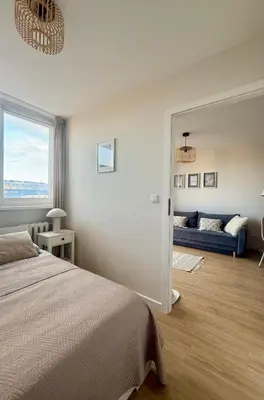 Łóżko lub łóżka w pokoju w obiekcie Cozy Stay Krochmalna Apartment