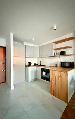 Kuchnia lub aneks kuchenny w obiekcie Cozy Stay Żelazna Apartment