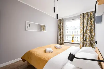 Łóżko lub łóżka w pokoju w obiekcie Białołęka Charming Apartment by BookingHost