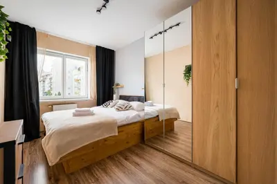 Łóżko lub łóżka w pokoju w obiekcie Metro Ursynów Superior Apartment by BookingHost