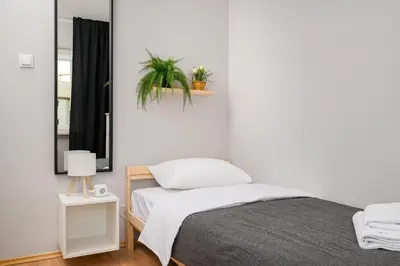 Łóżko lub łóżka w pokoju w obiekcie Metro Ursynów Superior Apartment by BookingHost