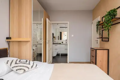 Łóżko lub łóżka w pokoju w obiekcie Metro Ursynów Superior Apartment by BookingHost