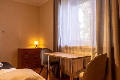Łóżko lub łóżka w pokoju w obiekcie Spacious Apartment with a Balcony in Bielany