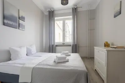 Łóżko lub łóżka w pokoju w obiekcie Urban Chic - Comfortable 2-Bedroom in City Center, Marszałkowska