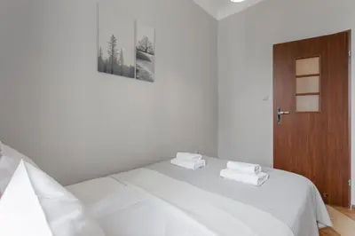 Łóżko lub łóżka w pokoju w obiekcie Urban Chic - Comfortable 2-Bedroom in City Center, Marszałkowska