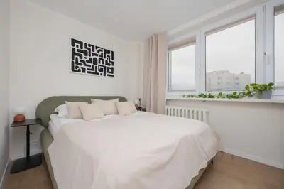 Łóżko lub łóżka w pokoju w obiekcie Unique 2 Bedroom Apartment with Air Conditioning in Warsaw by Noclegi Renters