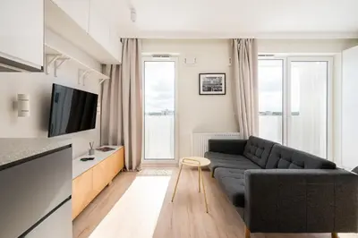 Telewizja i/lub zestaw kina domowego w obiekcie Białołęka Deluxe Studio by BookingHost