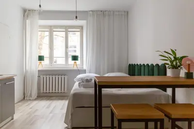 Łóżko lub łóżka w pokoju w obiekcie The Green Poznańska
