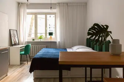 Łóżko lub łóżka w pokoju w obiekcie The Green Poznańska
