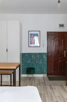 Łóżko lub łóżka w pokoju w obiekcie The Green Poznańska