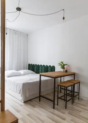 Łóżko lub łóżka w pokoju w obiekcie The Green Poznańska