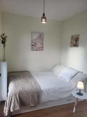 Łóżko lub łóżka w pokoju w obiekcie Apartament OFFI