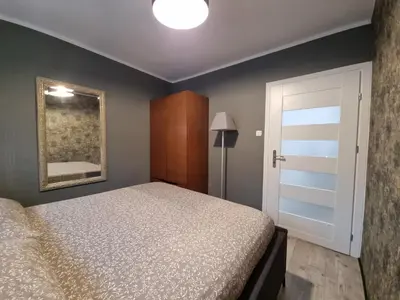 Łóżko lub łóżka w pokoju w obiekcie Wola Mirow 3 room apartment