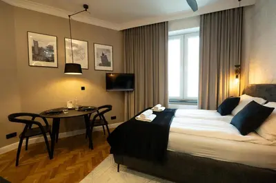 Łóżko lub łóżka w pokoju w obiekcie Goldline Premium Studio City Center