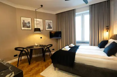 Łóżko lub łóżka w pokoju w obiekcie Goldline Premium Studio City Center