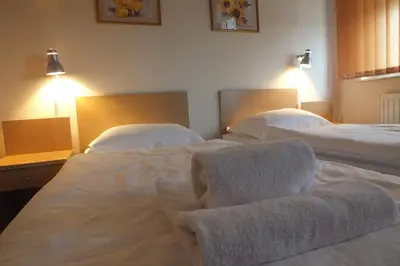 Łóżko lub łóżka w pokoju w obiekcie Motel Subaru