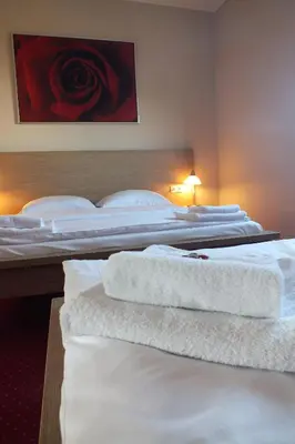 Łóżko lub łóżka w pokoju w obiekcie Motel Subaru