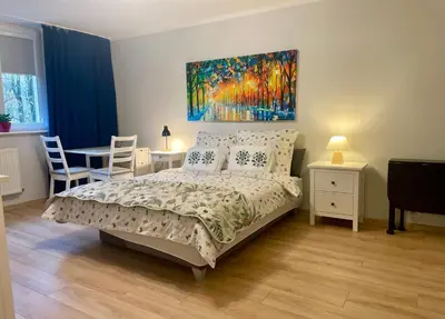 Łóżko lub łóżka w pokoju w obiekcie Marti apartament Metro Bródno