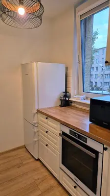Kuchnia lub aneks kuchenny w obiekcie Marti apartament Metro Bródno